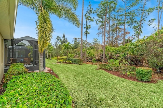 view of yard with a lanai