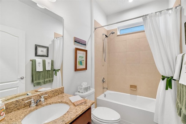 full bathroom featuring shower / tub combo, vanity, and toilet