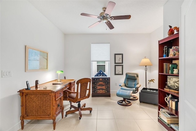 tiled office space featuring ceiling fan