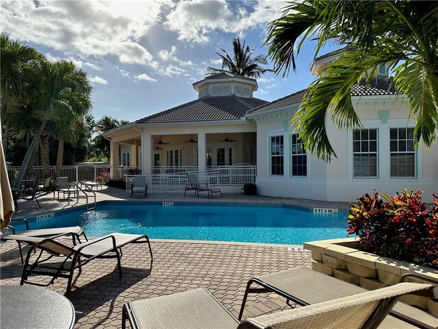 944 Island Club Sq, Vero Beach, FL 32963 - community pool with a ceiling fan, fence, and a patio area