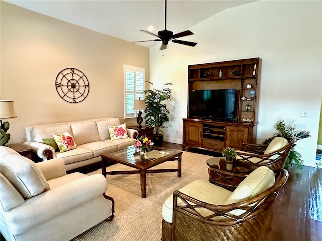 living room featuring ceiling fan and vaulted ceiling