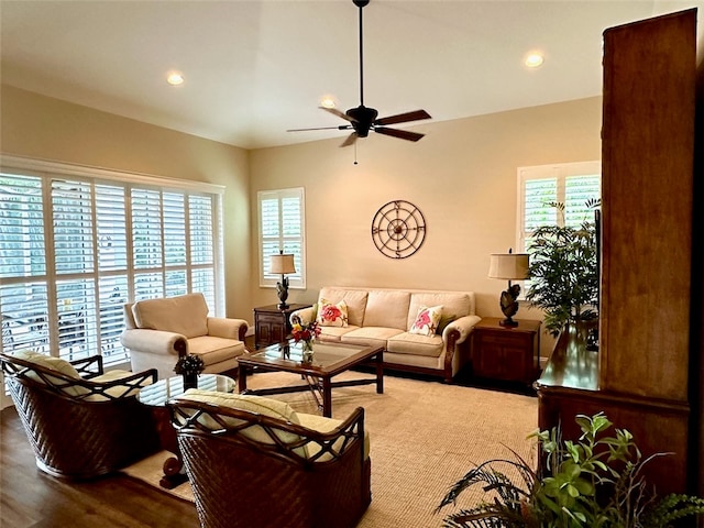 living room with hardwood / wood-style flooring and ceiling fan