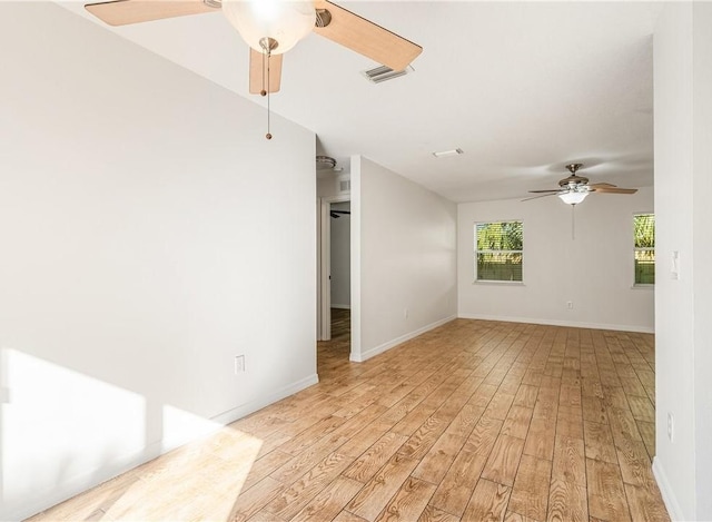 unfurnished room featuring ceiling fan and light wood-type flooring