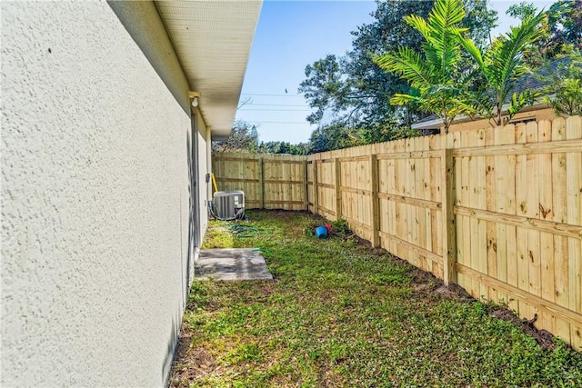 view of yard with central AC unit