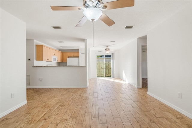 unfurnished living room featuring light hardwood / wood-style flooring