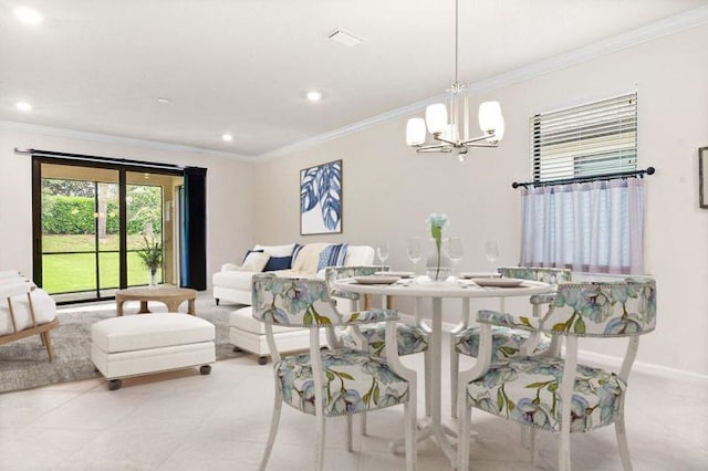 dining room featuring crown molding and an inviting chandelier