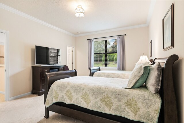 bedroom with light tile patterned floors and a textured ceiling