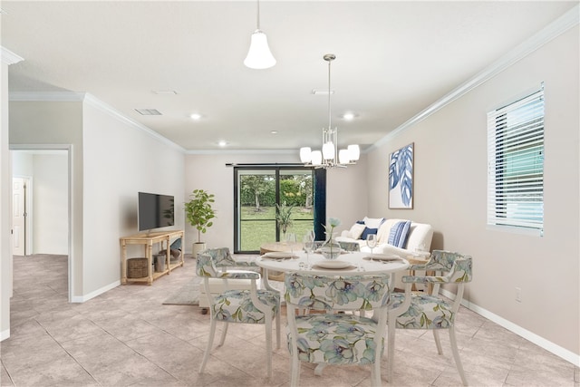 tiled dining space featuring crown molding and an inviting chandelier