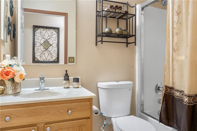 full bathroom with vanity, shower / bath combination with curtain, and toilet