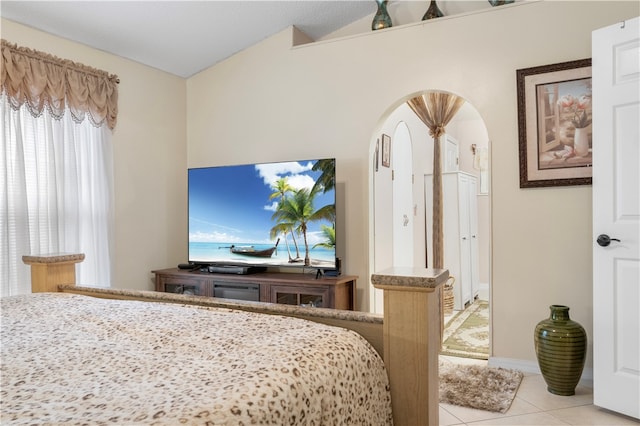 tiled bedroom featuring multiple windows