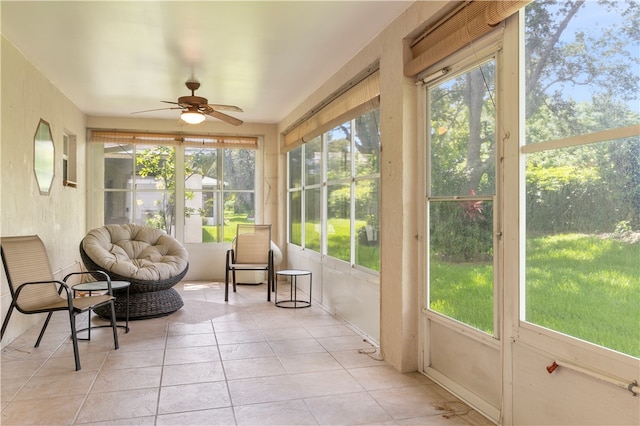 sunroom featuring a wealth of natural light and ceiling fan