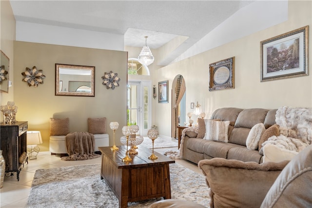 living room with lofted ceiling and light tile patterned flooring