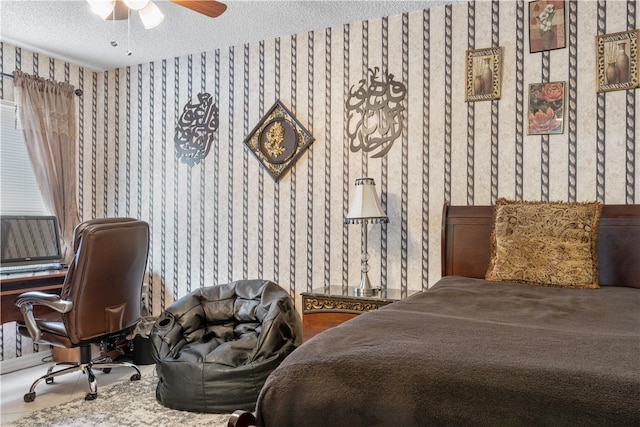 bedroom featuring a textured ceiling and ceiling fan