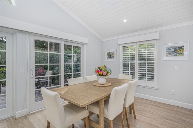 dining area featuring light hardwood / wood-style floors, lofted ceiling, and wood ceiling