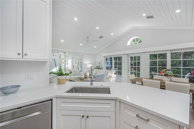 kitchen featuring white cabinetry, dishwasher, sink, wooden ceiling, and tasteful backsplash