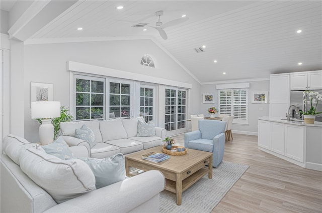 living room featuring a healthy amount of sunlight, light hardwood / wood-style floors, ceiling fan, and wooden ceiling