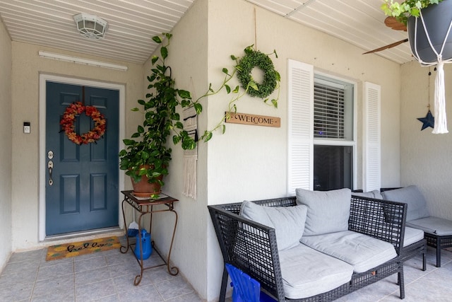 doorway to property featuring covered porch