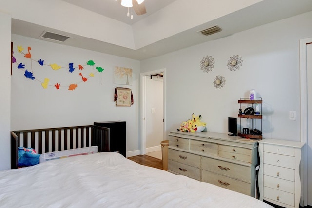 bedroom with ceiling fan and dark hardwood / wood-style floors