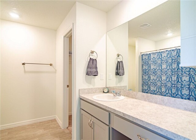 1580 Eastlake Ln, Sebastian, FL 32958 - bathroom with vanity, wood finished floors, and baseboards