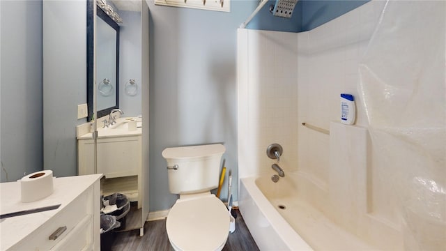 full bathroom with hardwood / wood-style floors, vanity, toilet, and shower / tub combination