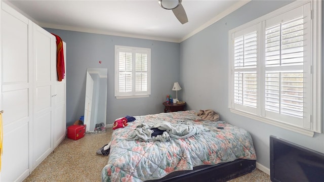 bedroom with ceiling fan and ornamental molding