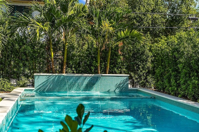 view of pool featuring pool water feature