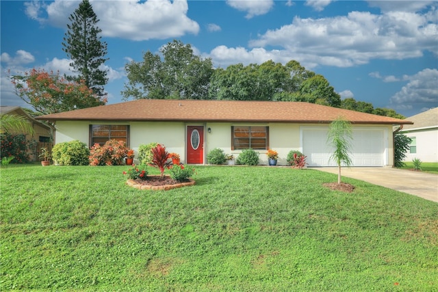 ranch-style home featuring a garage and a front lawn