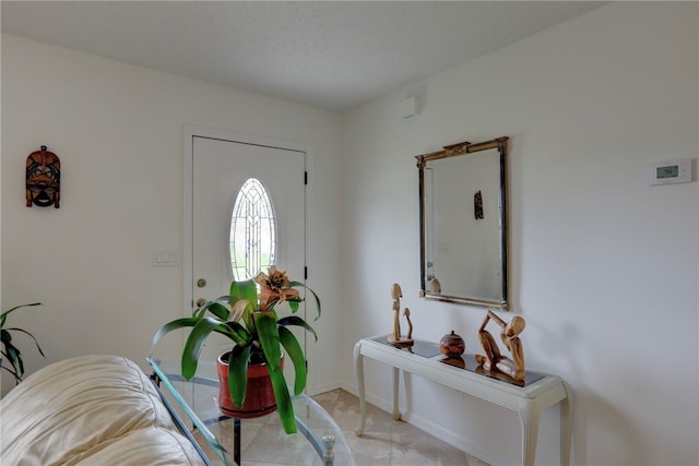 foyer featuring a textured ceiling