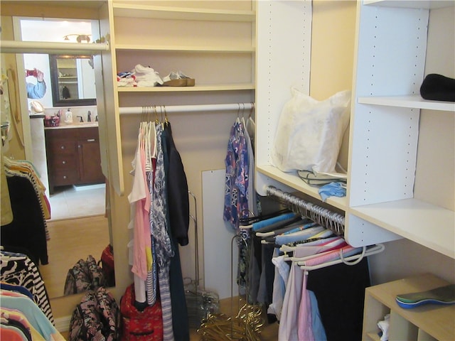 walk in closet with tile patterned floors