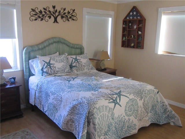 bedroom featuring hardwood / wood-style floors