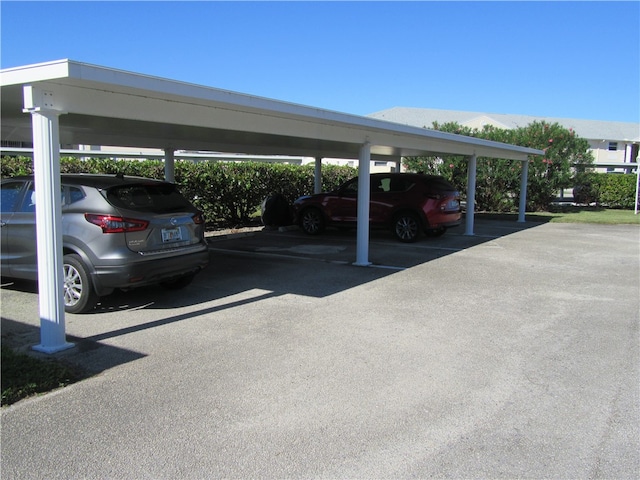 view of vehicle parking featuring a carport