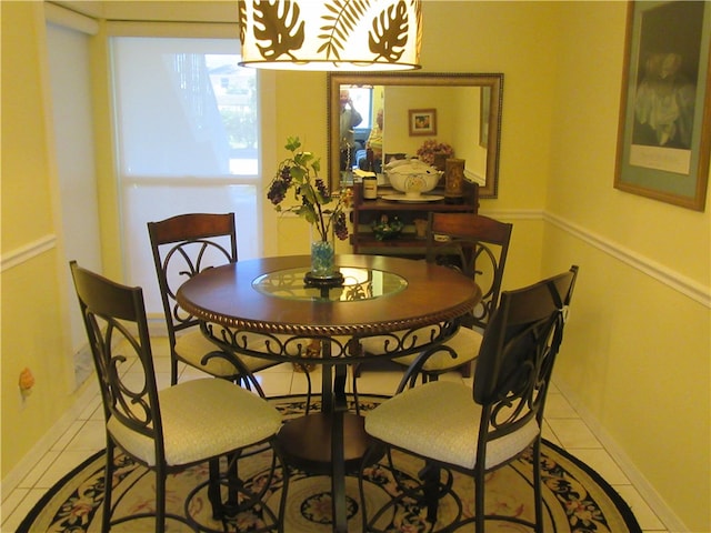 dining space featuring light tile patterned flooring