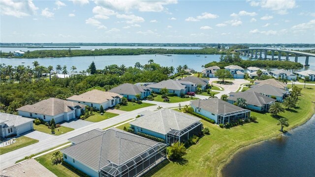 9266 Orchid Cove Cir, Vero Beach, FL 32963 - aerial perspective of suburban area with a nearby body of water