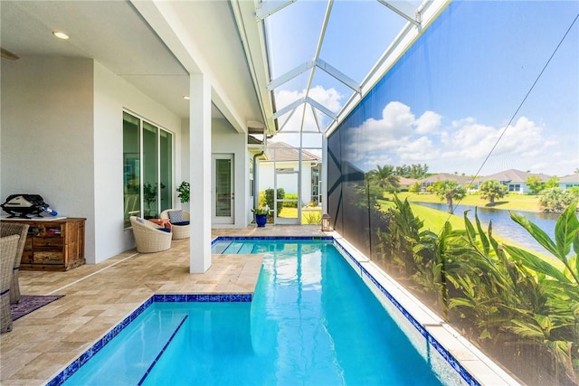 9266 Orchid Cove Cir, Vero Beach, FL 32963 - outdoor pool featuring a patio, a water view, and glass enclosure