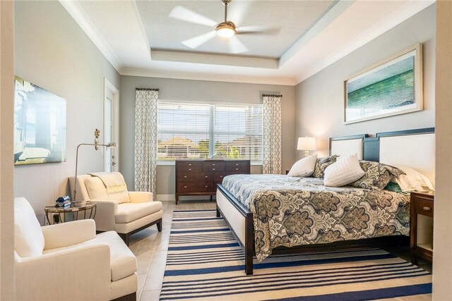 9266 Orchid Cove Cir, Vero Beach, FL 32963 - bedroom with a raised ceiling, ceiling fan, and ornamental molding