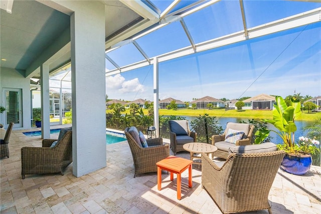 9266 Orchid Cove Cir, Vero Beach, FL 32963 - view of patio / terrace with a lanai, an outdoor pool, a residential view, and a water view