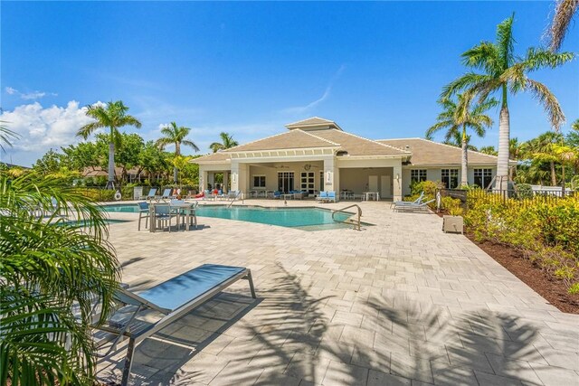 9266 Orchid Cove Cir, Vero Beach, FL 32963 - community pool featuring a patio area