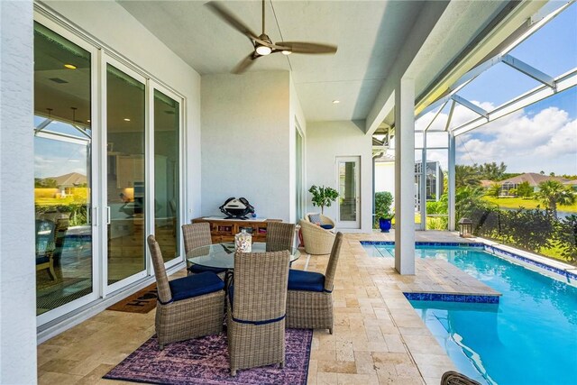 9266 Orchid Cove Cir, Vero Beach, FL 32963 - outdoor pool with ceiling fan, a patio area, and glass enclosure