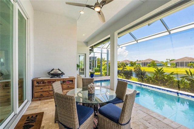 9266 Orchid Cove Cir, Vero Beach, FL 32963 - sunroom featuring a pool, a ceiling fan, a residential view, and outdoor dining space