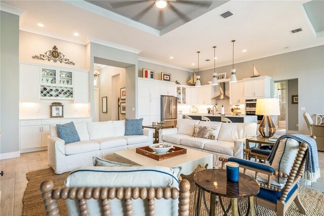 9266 Orchid Cove Cir, Vero Beach, FL 32963 - living area with recessed lighting, a ceiling fan, and ornamental molding