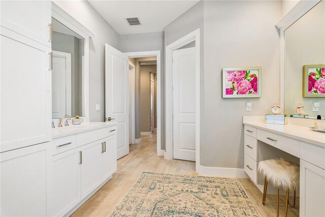 9266 Orchid Cove Cir, Vero Beach, FL 32963 - full bathroom with vanity and wood finished floors