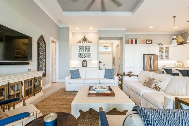 9266 Orchid Cove Cir, Vero Beach, FL 32963 - living area featuring recessed lighting, ornamental molding, a chandelier, and a raised ceiling