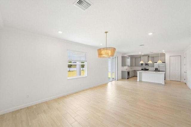 3544 Angler Dr, Fort Pierce, FL 34946 - unfurnished living room featuring light wood-style flooring and recessed lighting