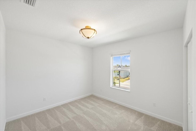 3544 Angler Dr, Fort Pierce, FL 34946 - spare room featuring light carpet and baseboards