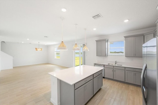 3544 Angler Dr, Fort Pierce, FL 34946 - kitchen featuring stainless steel appliances, gray cabinets, light wood-type flooring, light countertops, and recessed lighting
