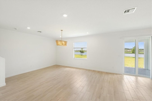 3544 Angler Dr, Fort Pierce, FL 34946 - unfurnished room featuring plenty of natural light, light wood-type flooring, a water view, and recessed lighting
