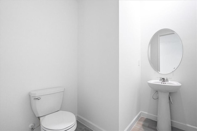 3544 Angler Dr, Fort Pierce, FL 34946 - bathroom featuring toilet and baseboards