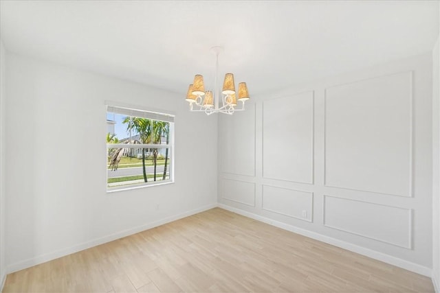 3544 Angler Dr, Fort Pierce, FL 34946 - unfurnished room featuring a chandelier and light wood-style floors