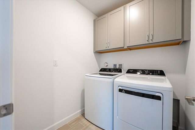 3544 Angler Dr, Fort Pierce, FL 34946 - washroom with cabinet space, washer and dryer, and light wood-type flooring