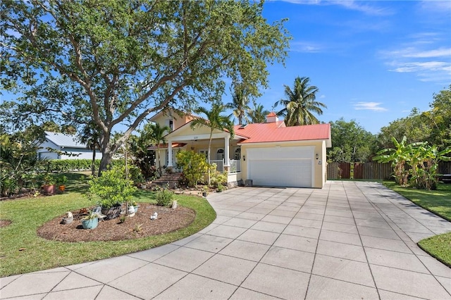 view of front of home with a garage and a front lawn